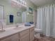 Bright bathroom with vanity, shower, and toilet at 32622 Oak Park Dr, Leesburg, FL 34748