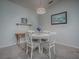 Bright dining area with white table and chairs at 32622 Oak Park Dr, Leesburg, FL 34748