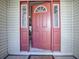 Open coral front door offering a view of the home's interior at 32622 Oak Park Dr, Leesburg, FL 34748