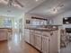 Eat-in kitchen with island and access to Gathering room at 32622 Oak Park Dr, Leesburg, FL 34748