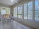 Relaxing sunroom featuring comfy seating and serene views at 32622 Oak Park Dr, Leesburg, FL 34748