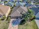 Property with decorative driveway and manicured lawn at 3281 Bell Ter, The Villages, FL 32163