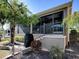 Screened porch with a patio and grill at 3281 Bell Ter, The Villages, FL 32163