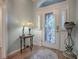 Elegant entryway with stained glass door and hardwood floors at 3281 Bell Ter, The Villages, FL 32163