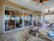 Relaxing lanai with wicker furniture and sliding glass doors at 3281 Bell Ter, The Villages, FL 32163