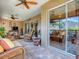 Outdoor patio with wicker furniture and ceiling fans at 3281 Bell Ter, The Villages, FL 32163