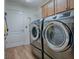 Laundry room with modern washer and dryer at 3281 Bell Ter, The Villages, FL 32163