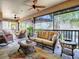 Relaxing screened porch with wicker furniture and ceiling fans at 3281 Bell Ter, The Villages, FL 32163