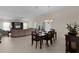 Bright dining room featuring a spacious table with six chairs, and access to the back patio at 3538 Mistletoe Ct, The Villages, FL 32163