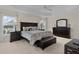 Large main bedroom with a king-size bed, dresser, and plenty of natural light at 3538 Mistletoe Ct, The Villages, FL 32163