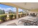 Relaxing screened porch with seating area and lovely view at 3538 Mistletoe Ct, The Villages, FL 32163