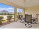 Spacious screened porch with table and chairs for outdoor dining at 3538 Mistletoe Ct, The Villages, FL 32163