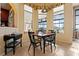 Charming breakfast nook with wood table and chairs, overlooking the garden at 3546 Tropical Seas Loop, Tavares, FL 32778