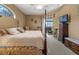 Main bedroom with king-size bed, dresser, and sliding doors to the patio at 3546 Tropical Seas Loop, Tavares, FL 32778