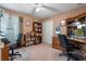 Bright home office with two desks, ample built-in shelving, and window light at 3546 Tropical Seas Loop, Tavares, FL 32778