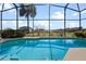 Refreshing screened-in pool perfect for relaxation at 3546 Tropical Seas Loop, Tavares, FL 32778