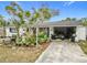 Front view of the house with lush landscaping at 3566 Seminole St, Gotha, FL 34734