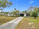 Front view of house, showing driveway and landscaping at 3566 Seminole St, Gotha, FL 34734