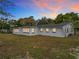 Back of the house, showing large windows and expansive yard at 3566 Seminole St, Gotha, FL 34734