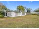 Side view of a white house with a large backyard at 3566 Seminole St, Gotha, FL 34734