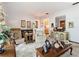 Living room with a view into the kitchen and seating area at 3566 Seminole St, Gotha, FL 34734