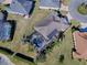 Aerial view of a house showcasing a private pool and lush landscaping at 3590 Ithaca Ter, The Villages, FL 32163