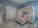 bedroom with bunks, cheerful bedding, and ample closet space at 3590 Ithaca Ter, The Villages, FL 32163