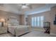 Light and airy bedroom with white furniture and window shutters at 3590 Ithaca Ter, The Villages, FL 32163