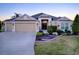 Beautiful one-story home with three-car garage and well-maintained landscaping at 3590 Ithaca Ter, The Villages, FL 32163