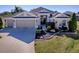 Attractive one-story home with three-car garage and landscaped yard at 3590 Ithaca Ter, The Villages, FL 32163