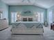 Serene main bedroom features a light and airy color scheme at 3590 Ithaca Ter, The Villages, FL 32163