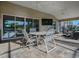 Covered patio with seating and pool view at 3590 Ithaca Ter, The Villages, FL 32163