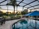 Stunning pool and spa with a screened enclosure and sunset views at 3590 Ithaca Ter, The Villages, FL 32163