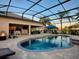 Expansive pool and patio area with fire pit at 3590 Ithaca Ter, The Villages, FL 32163