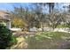 Large, fenced backyard with mature trees and a storage shed at 37008 Shalimar Dr, Fruitland Park, FL 34731