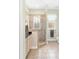 Bathroom featuring a glass enclosed shower with tile surround and neutral cabinets at 37008 Shalimar Dr, Fruitland Park, FL 34731