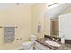 Bathroom featuring a toilet, granite-topped sink, and walk-in shower with tile surround at 37008 Shalimar Dr, Fruitland Park, FL 34731