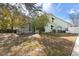 Lovely home showcasing a covered porch, attached garage, and lush landscaping, creating a welcoming curb appeal at 37008 Shalimar Dr, Fruitland Park, FL 34731