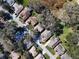 Aerial view of homes, roads and a neighborhood lake at 3716 Plantation Blvd, Leesburg, FL 34748