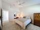 Bedroom with mirrored closet and access to hallway at 3716 Plantation Blvd, Leesburg, FL 34748