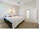 Bright bedroom featuring a comfortable bed and ceiling fan at 3716 Plantation Blvd, Leesburg, FL 34748