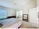 Comfortable bedroom with sliding glass doors to balcony at 3716 Plantation Blvd, Leesburg, FL 34748