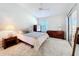 Well-lit bedroom with ceiling fan and ample closet space at 3716 Plantation Blvd, Leesburg, FL 34748