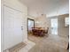 Bright dining area with table and chairs, view to kitchen at 3716 Plantation Blvd, Leesburg, FL 34748