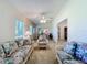 Serene living room with wicker sofas and floral patterns, providing a peaceful ambiance at 3716 Plantation Blvd, Leesburg, FL 34748