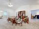 Living room with mid-century furniture and vaulted ceiling at 3716 Plantation Blvd, Leesburg, FL 34748