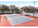 Newly resurfaced tennis courts with ample space and shade at 3716 Plantation Blvd, Leesburg, FL 34748