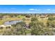 Panoramic view of a lovely home nestled within a well-maintained golf course community and beautiful pond at 39335 Harbor Hills Blvd, Lady Lake, FL 32159