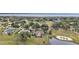 Aerial view of house, golf course, and waterfront at 39335 Harbor Hills Blvd, Lady Lake, FL 32159