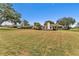 Spacious backyard with a view of neighboring houses at 39335 Harbor Hills Blvd, Lady Lake, FL 32159